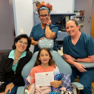 Image of Dr. Garzon and staff with patient
